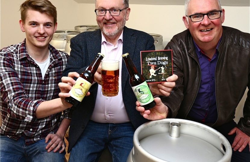 David Mundell MP, managing director Michael Tough and head brewer Tom Barr Lowland Brewery's 'Twa Dugs'
