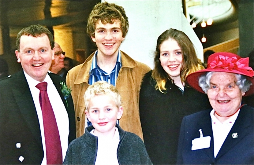 members of the Mundell family at the royal opening of the current Holyrood building in 2004.  Back, left to right: David, son Oliver (now MSP), daughter Eve and Dorah (David's mother). Front: son Lewis
