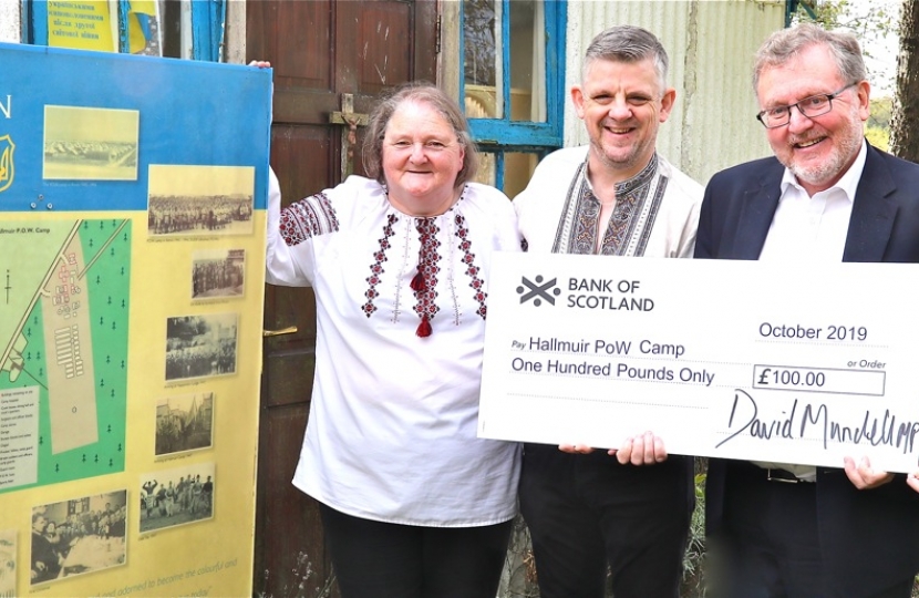 Dumfriesshire, Clydesdale and Tweeddale MP David Mundell, third from left, presents a cheque to project team members, left to right: Ina Pufkji, chairwoman; Stefan Danczak and Mary (Mychalyschyn) MacRae, treasurer.