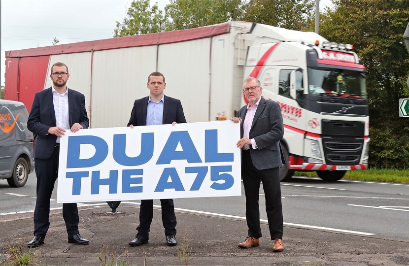 Scottish Conservatives' leader Douglas Ross on a visit to the A75 with local MSP Oliver Mundell, left, and MP David Mundell, right