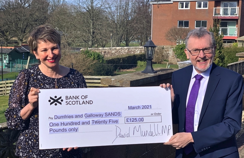 CHARITY BOOST . . . David Mundell, MP, presents a cheque to Alison Hall, representing Sands (Dumfries and Galloway)