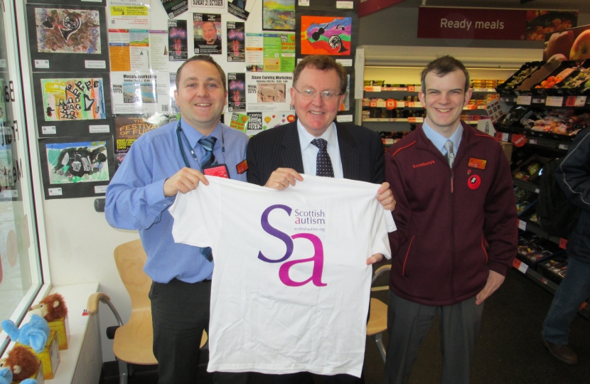 MP David Mundell with store manager Will Pitcairn and Alastair Patience, trainee