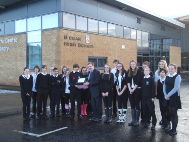 David Mundell accepts a box of petitions and letters from Biggar High students